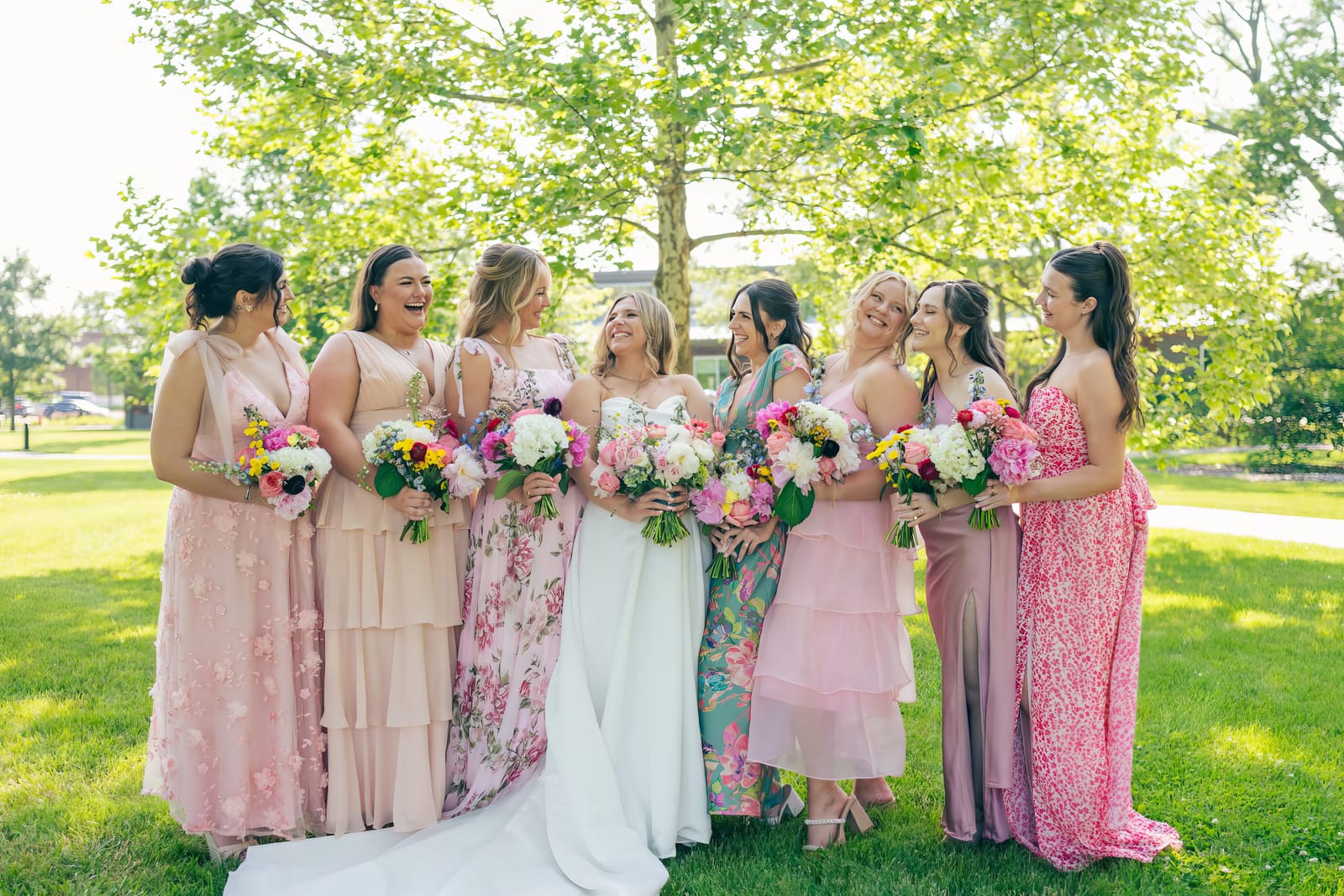 Carol surrounded by her bridesmaids on the lawn